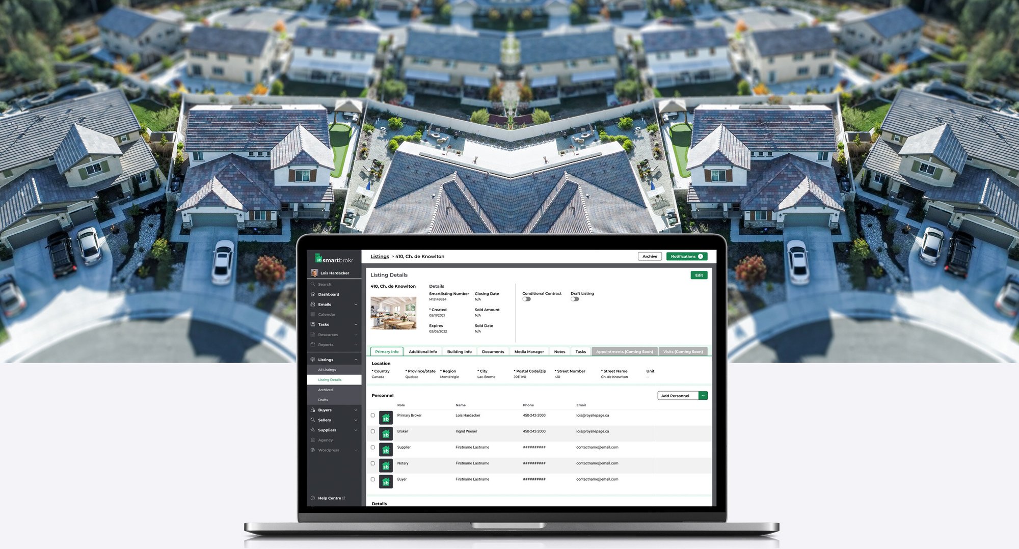 Image of a laptop displaying the Smartbrokr app in front of a birds-eye view of a residential street